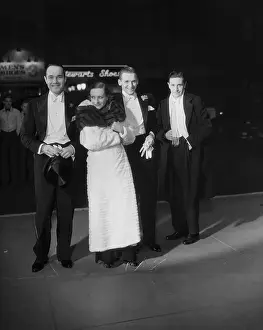 Prints of (Original Caption) 1932-Hollywood, California: Arriving to attend the premiere of movie Union Dept are, left to right: Bill Haines; Joan Crawford (head slightly tilted); her husband A Glamorous Life Captured: Actors Arrive To Attend Movie Premiere