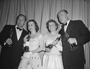 Actors Holding Academy Award Trophies