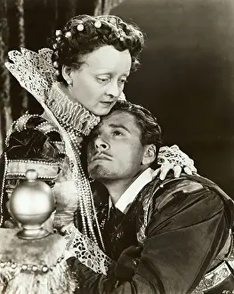 Comforting Prints: Actress Bette Davis and Errol Flynn Performing in Royal Costumes