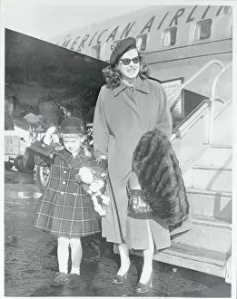 Hyman Prints: Actress Bette Davis Pausing With Daughter Near Airplane