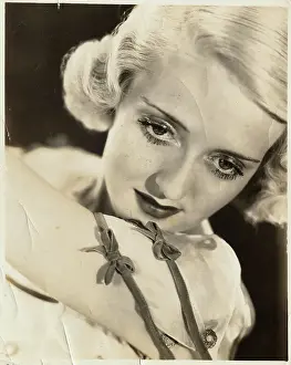 Actress Bette Davis Posing in Bow Adorned Dress