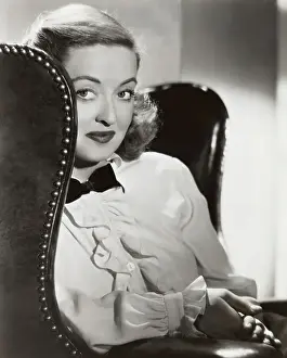 Actress Bette Davis Sitting in Chair