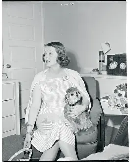 Bel Air Prints: Actress Bette Davis Sitting With Her Dog