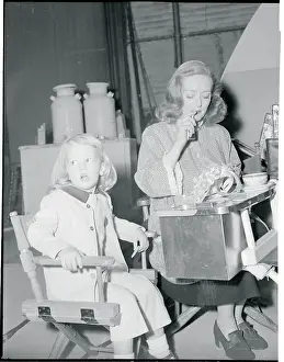 Actress Bette Davis Studying With Daughter on Film Set