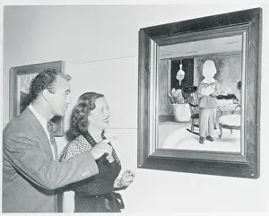 Actress Bette Davis and William Grant Sherry Gazing at Artwork