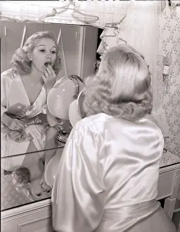 Femininity Prints: Actress Betty Grable Applying Lipstick