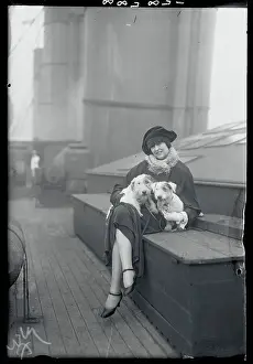 Actress Corrine Barker Holding Dogs