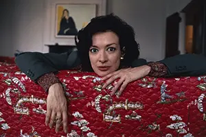 Actress Dixie Carter Leaning over Couch