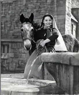 Actress Next To Donkey, Well; Movie Stil