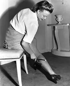 Stockings Prints: Actress Drawing Seams on a Stocking
