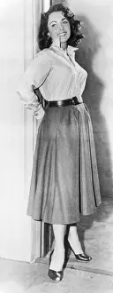 Actress Elizabeth Taylor Posing Against Door Frame