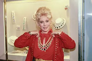 Actress Eva Gabor Choosing Jewelry for Her Wardrobe
