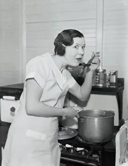 Actress Fritzie Ridgeway Tasting Food from Pot