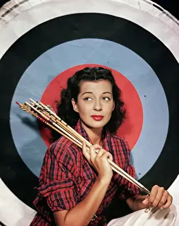Arrow Prints: Actress Gail Russell Sitting with Archery Target and Arrows