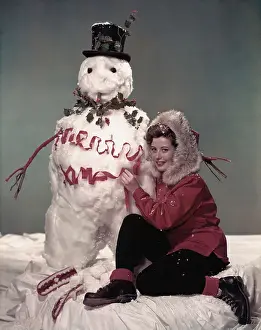 Actress Gloria De Haven with Snowman