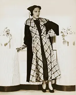 Actress Gloria Swanson Posing in Plaid Dress Coat