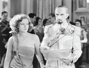 Prints of (Original Caption). USA: Greta Garbo and Eric Von Seyffertitz in the Mysterious Lady with Conrad Nagel directed by Fred Niblo, a Metro Goldwyn Mayer picture Timeless Elegance: The Iconic Greta Garbo Collection: Actress Greta Garbo and Eric Von Seyffertitz in The Mysterious Lady
