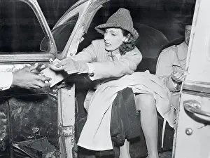 Actress Greta Garbo Paying Her Porter from Taxi