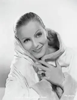 Prints of (Original Caption). USA: Greta Garbo, Metro-Goldwyn Mayer Timeless Elegance: The Iconic Greta Garbo Collection: Actress Greta Garbo Wearing White with Pulled Back Hairstyle