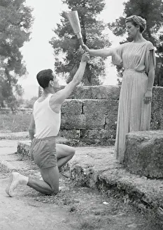Actress Handing Torch to Runner