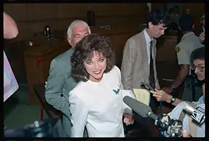 Actress Joan Collins Talking to Reporters
