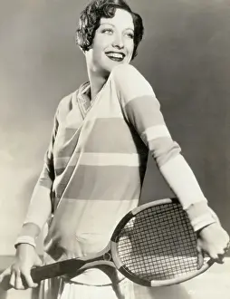 Prints of (Original Caption) 1928- The hiplength sweater worn once more in 1958 is here worn more than 20 years ago, by Joan Crawford who, at that time A Glamorous Life Captured: Actress Joan Crawford