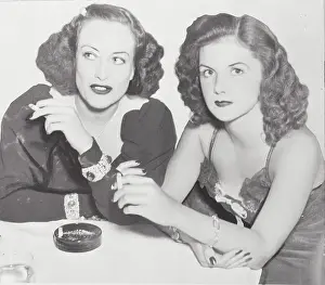 Prints of (Original Caption). New York: Glamour...Screen And Society Versions A Glamorous Life Captured: Actress Joan Crawford and Brenda Frazier at Table Together