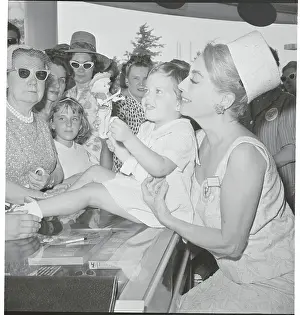 Actress Joan Crawford with Child at UNICEF Function