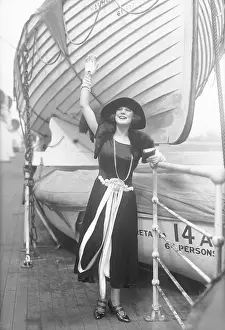 Actress Justine Johnstone Waving near Boat