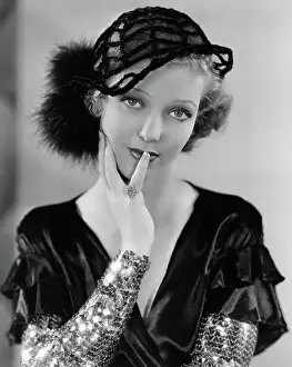 Actress Loretta Young Wearing Sequined Sleeved Dress