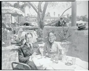 Prints of (Original Caption) Behind the Laughter: Lucille Ball's Unseen Moments: Actress Lucille Ball With Fiance Broderick Crawford at Outdoor Table