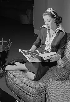 Actress Marie Wilson Reading Book While Lounging