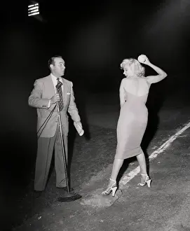 Actress Marilyn Monroe Throwing Baseball
