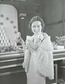 Maureen Osullivan Prints: Actress Maureen O'Sullivan with Donut Display
