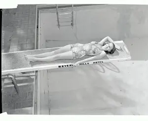 Actress Rita Hayworth Sunning Herself on Diving Board