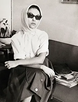 Actress Rita Moreno in Sunglasses and Scarf