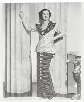 Peplum Prints: Actress Rosalind Russell Posing in Long Dress