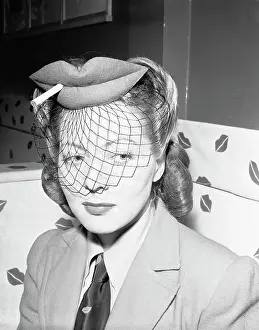 Actress Wearing Hat in Shape of Lips with Cigarette and Veil