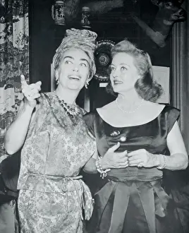 Actresses Bette Davis and Joan Crawford Standing and Talking