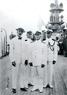 Admiral Caperton poses with a group of officers aboard the flagship Washington