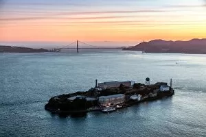 Golden Gate Suspension Bridge Collection: Aerial of Alcatraz at sunset, San Francisco, USA