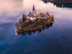 Ethereal Collection: Aerial drone view of Bled island at sunset, Slovenia