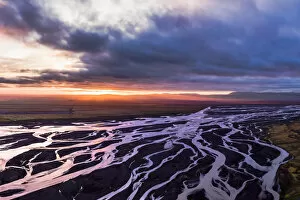 Images Dated 13th April 2018: Aerial drone view of braided river and midnight sun, Iceland