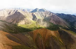 Aerial of mineral-rich Northern Mackenzie Mountains, Peel Watershed, Yukon Territory, Canada