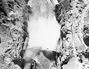 Prints of (Original Caption) 9/11/1936-Boulder Dam, AZ/NV- An electrical implulse released by President Roosevelt pressing a button on the opposite side of the continent today sent 3, 600 A Timeless Collection of Hoover Dam Photography: Aerial View of Boulder (Hoover) Dam