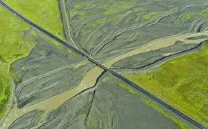 Aerial view of Ring Road No. 1 with a bridge crossing a tributary of the Skaftafellsa glacial river, Southern Region, Iceland