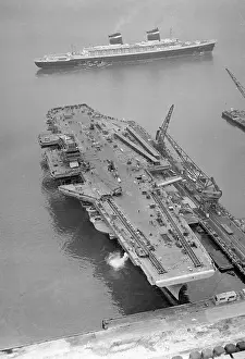 Aerial View of the SS United States Sailing Past the USS Forrestal