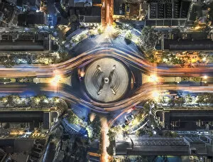 Urban Gallery: aerial top view traffic circle with speed light in city at night, Democracy Monument, bangkok