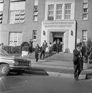 Exiting Prints: African American Child Leaving School Building