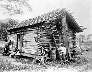 African American Family Outside Cottage
